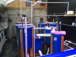 These are the fish growing tanks/filter tanks (clarifiers, mineralizers, and degassing tanks).